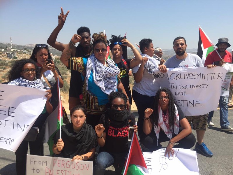 Delegates from the Movement for Black Lives join Palestinian organizers and activists in the West Bank village of Bilin during a weekly Friday protest against Israel’s occupation and colonization, 29 July. (via Facebook)