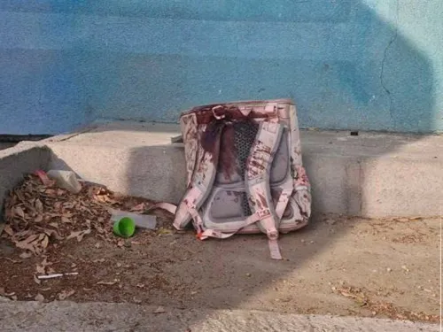 Backpack soaked in blood following attack on Tehran school