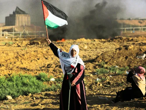 Palestinian woman with flag