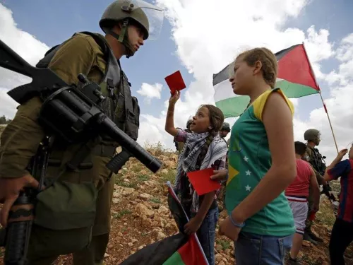 red card for israeli soldier nabi saleh.jpg