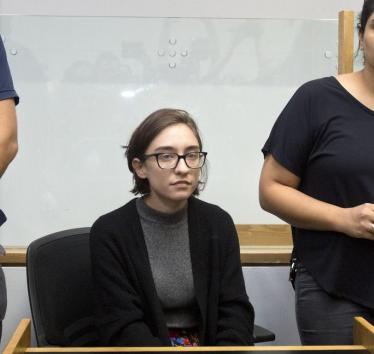 Lara Alqasem sits in a courtroom prior to a hearing at the district court in Tel Aviv, Thursday, Oct. 11, 2018. (Photo: Sebastian Scheiner / AP)