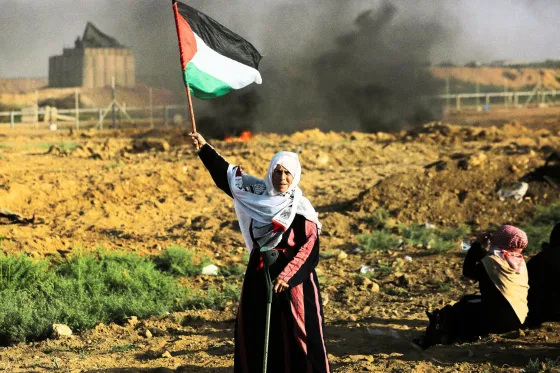 Palestinian woman with flag