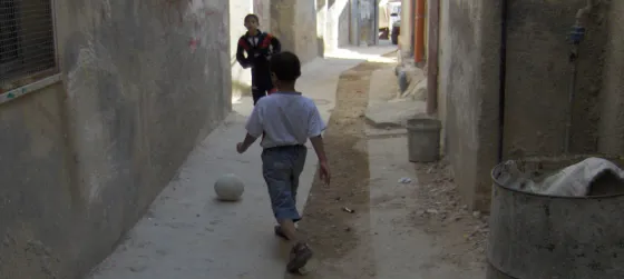 Palestinian boys playing footballl in al-Amari refugee camp
